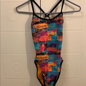 One piece swimsuit with open back.